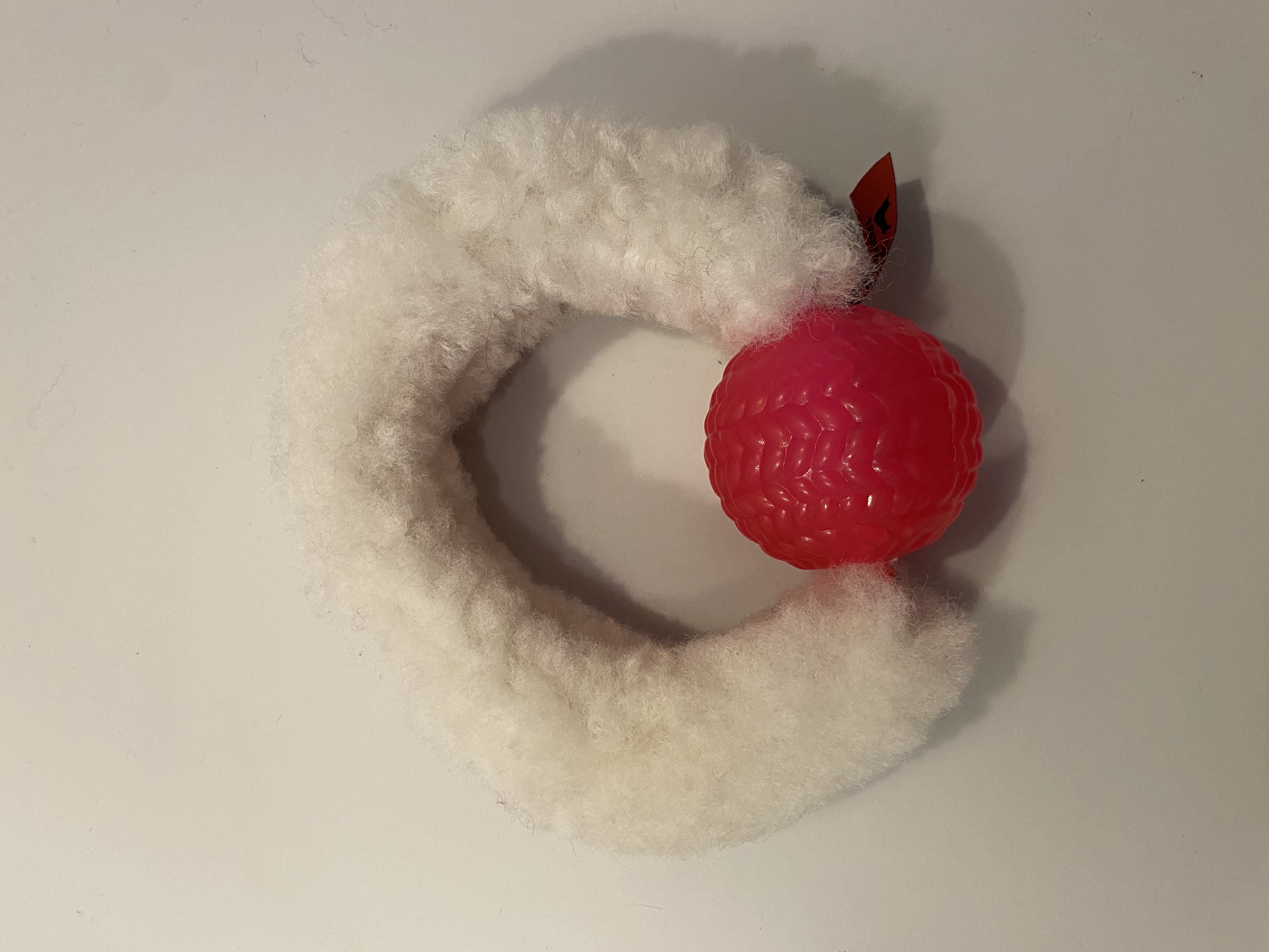 Fårskinnsring med boll