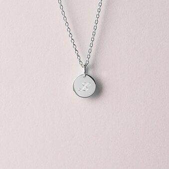 Silver necklace with a round pendant. Engravable.