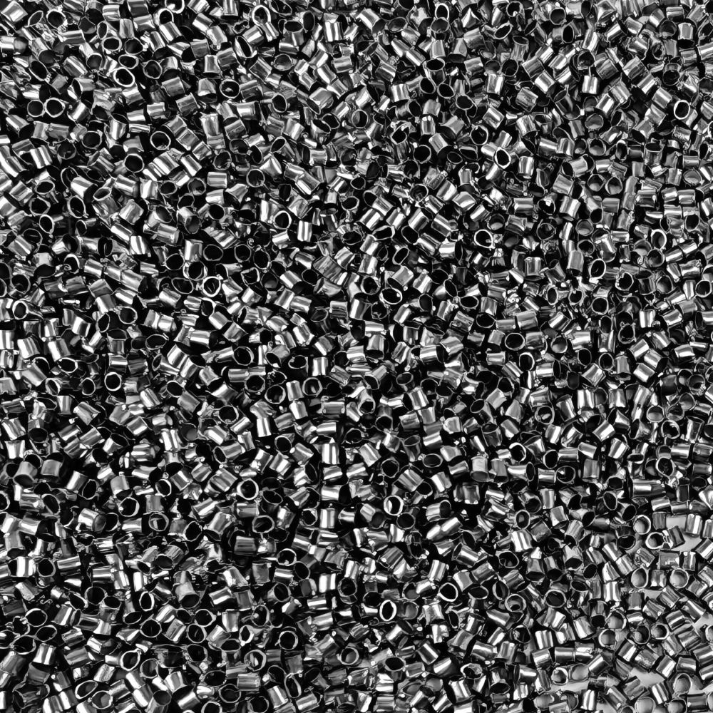 Tubformade klämpärlor i antiksilverfärg, ca 1,5 mm stora med 1 mm hål