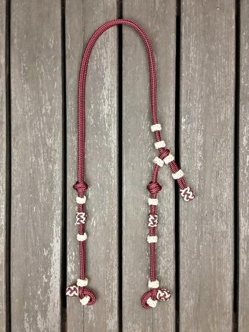 Headstall with knot adjustment and decorative knots