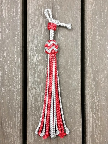 Neck rope with knot adjustment and decorative knots