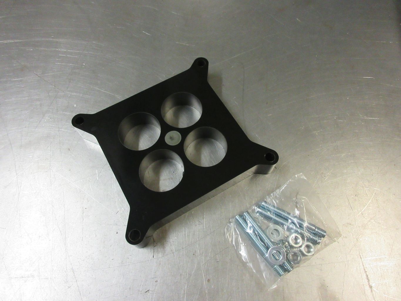 Spacerplatta Förgasare Plast 1´4-Port