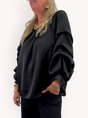 Glansig blus med volymärm
