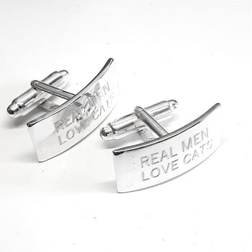 Silver cuff links with engraved text