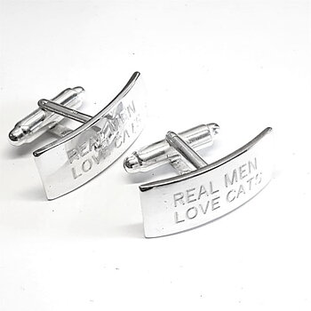 Silver cuff links with engraved text