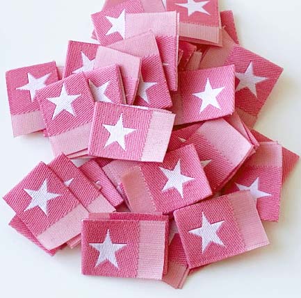 Woven folded label Dull pink with white star