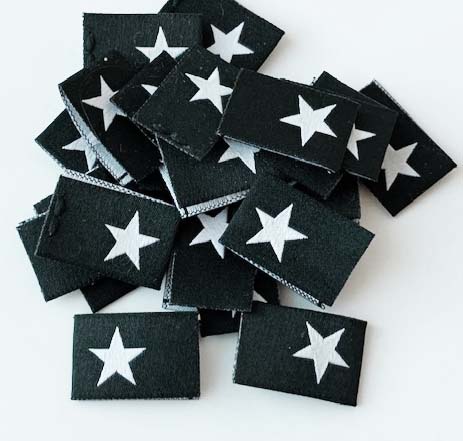 Woven folded label Black with white star