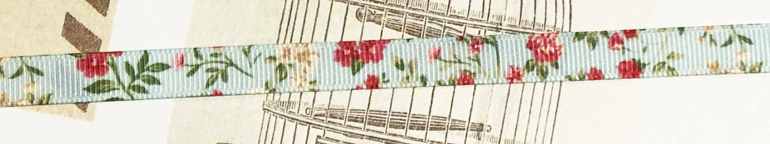 Printed ribbon flowers on turqse 10mm