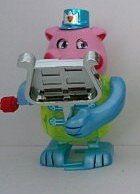 Pig with Xylophone Domino, 12 stk., Wind ups