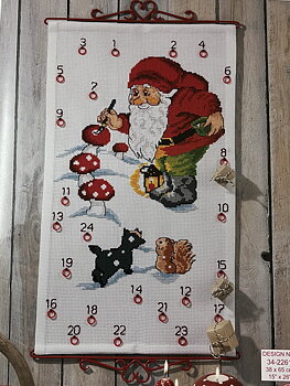 Adventskalender. Tomten målar flugsvampar.