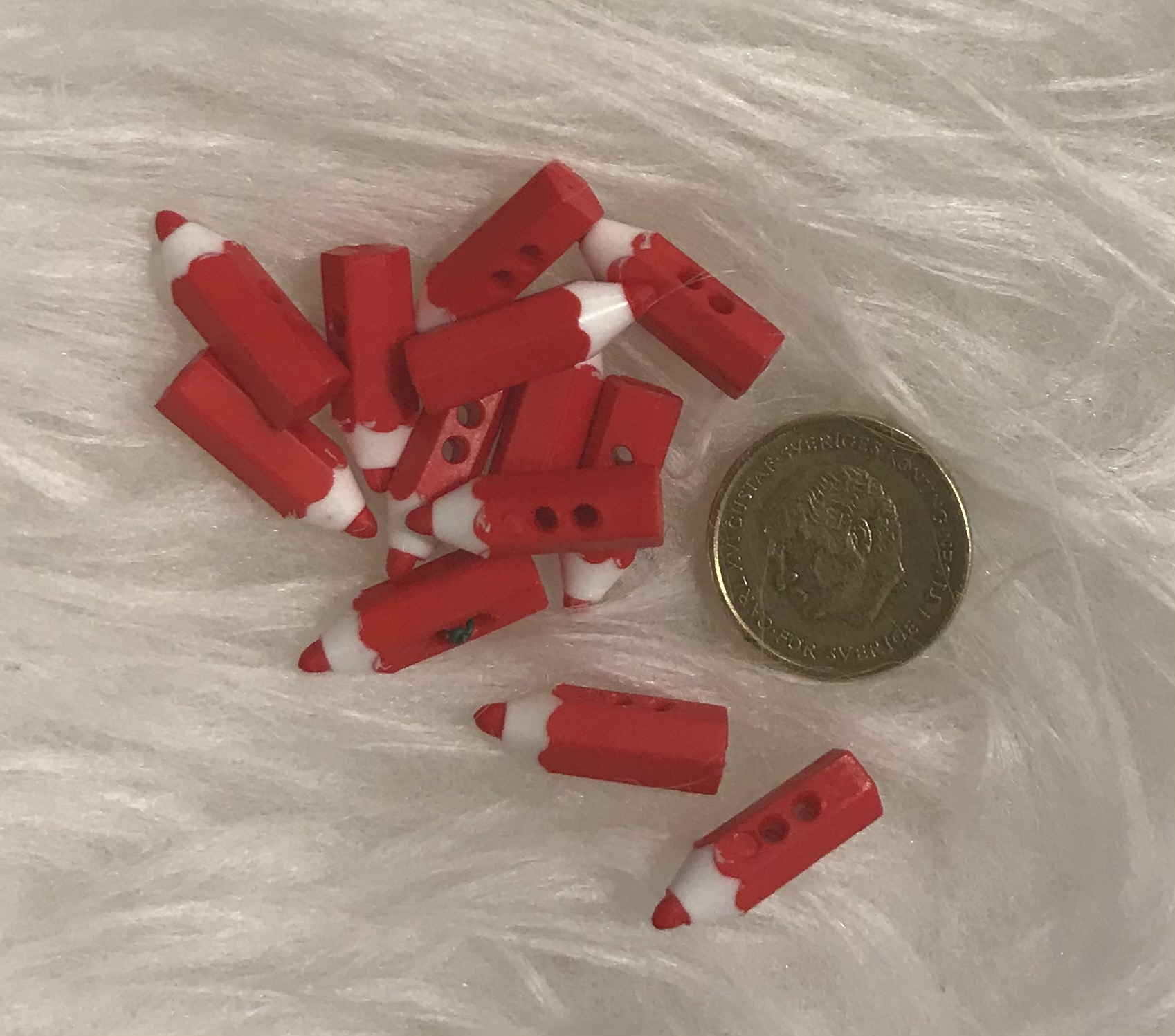 Figurknapp. Röd penna