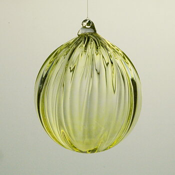 Glass ball, yellowish green.