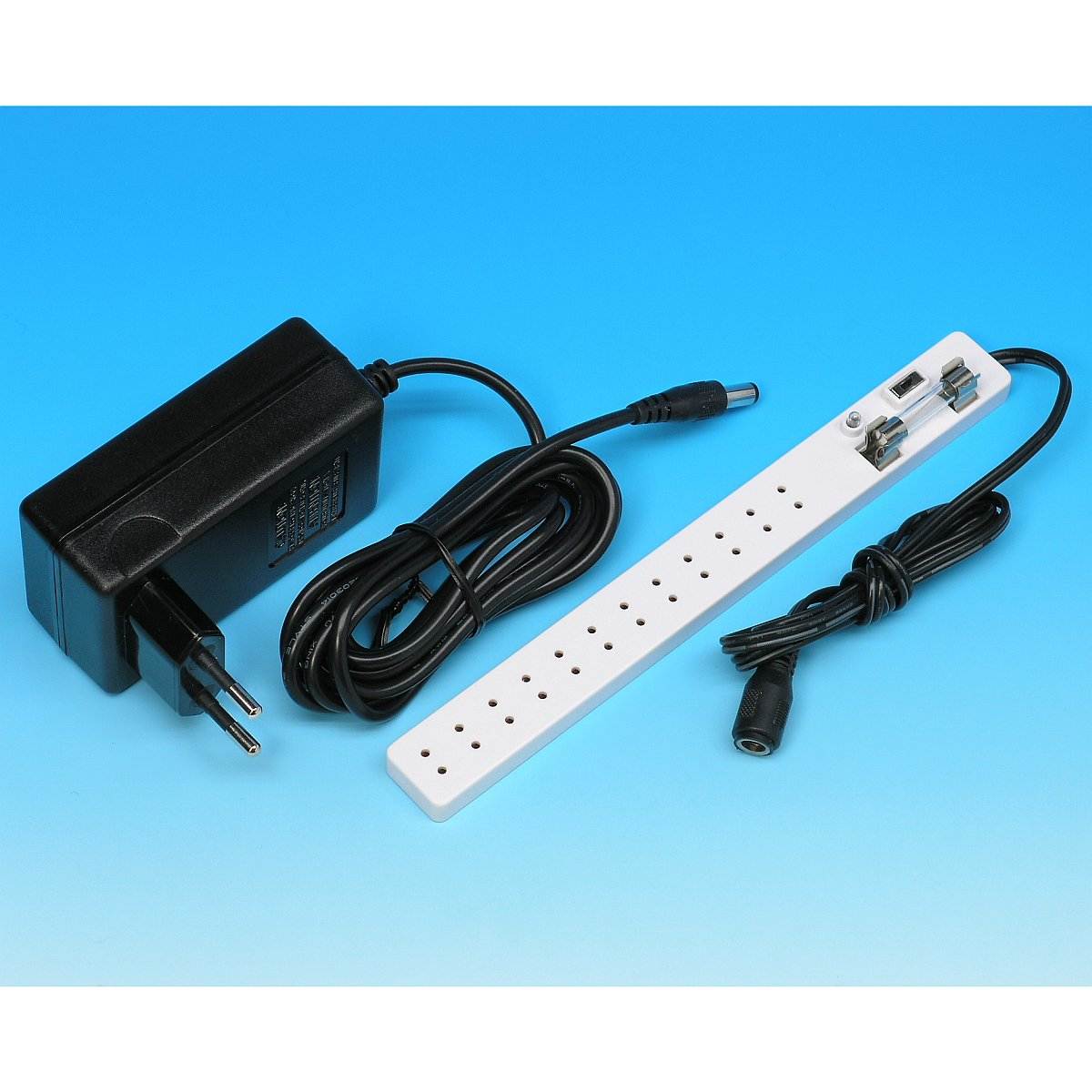 Plug-in transformer with socket connector strip