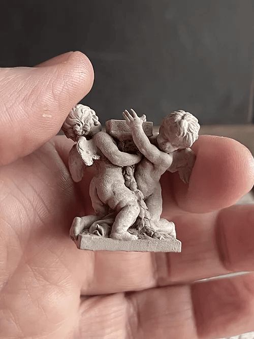 Two Putti with hands ready to carry -  from Alison Davies