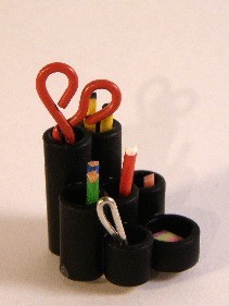 Mug with pens and scissors