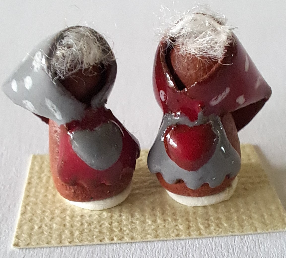 Two handmade - ceramics old woman