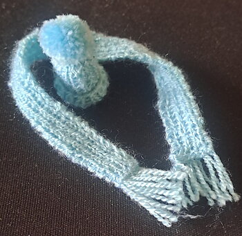 Lightblue knitted hat and scarf