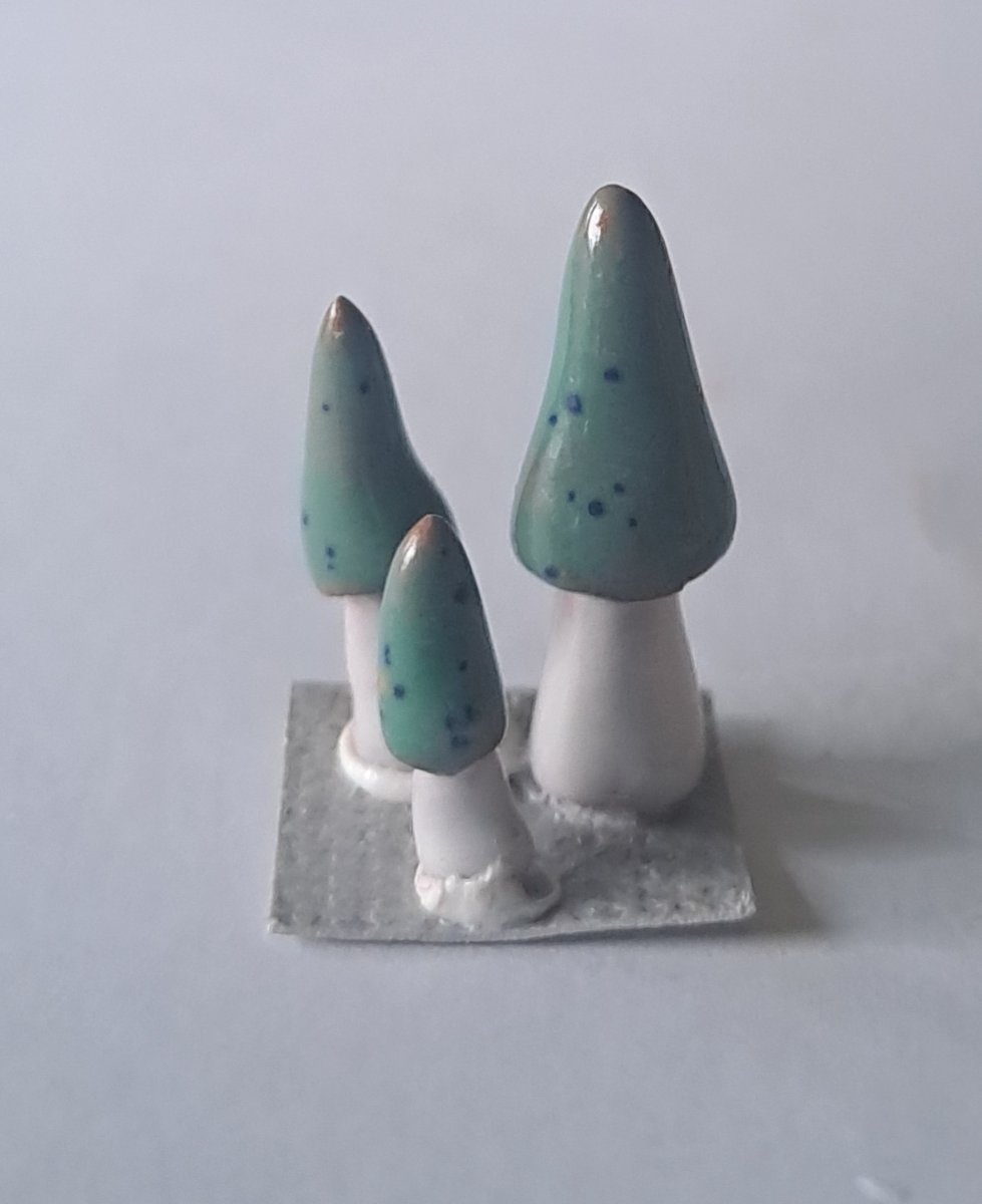 Mushrooms in creamics, green