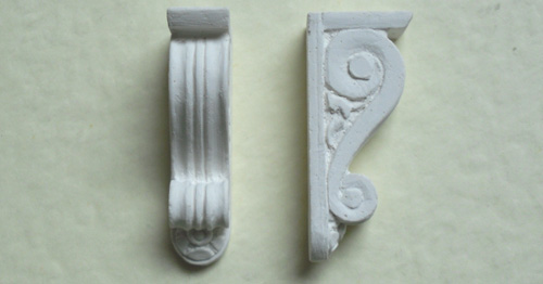 A pair of small brackets - hard casting plaster