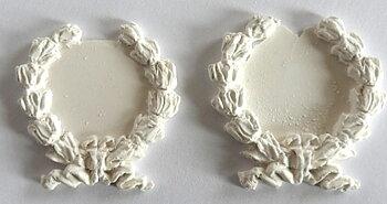 A pair of decorations rosette- hard casting plaster