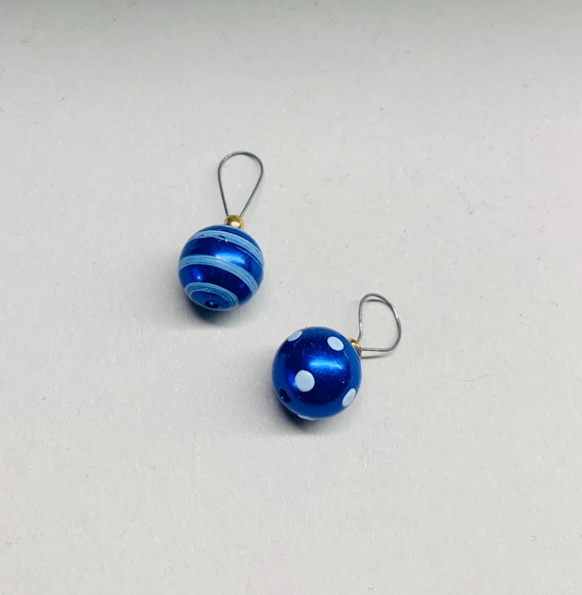 two handpainted christmas bauble in blue