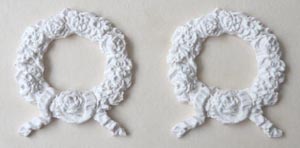 A pair of decorations rosette 2- hard casting plaster