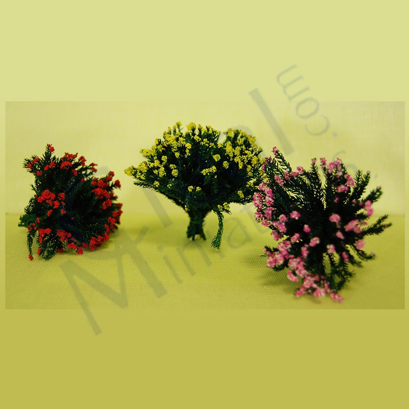 Tre blommande buskar