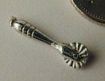 Pastry jigger in white metal