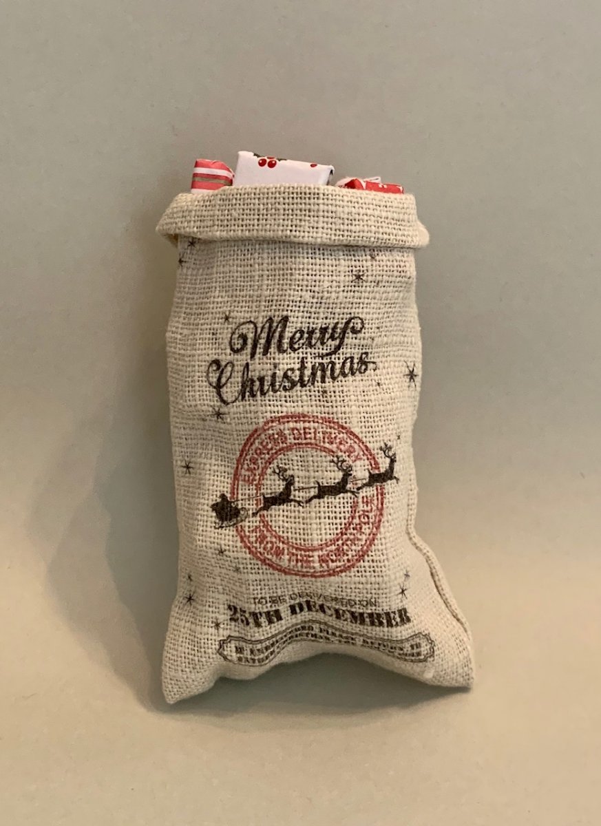 Open christmas mall sack with gifts - handmade in England