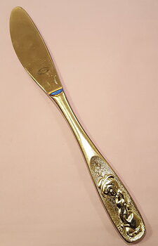Child with watering can knife
