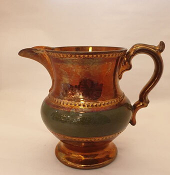Small pitcher luster glaze and green