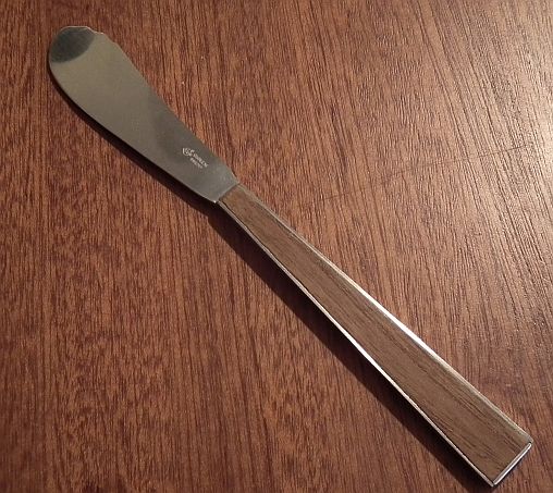 Butter knife with teak inlay