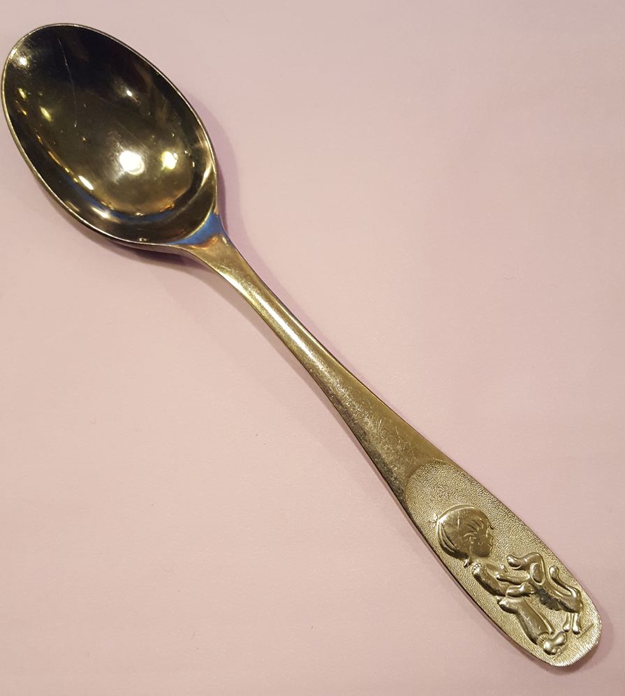 Child with dog spoon