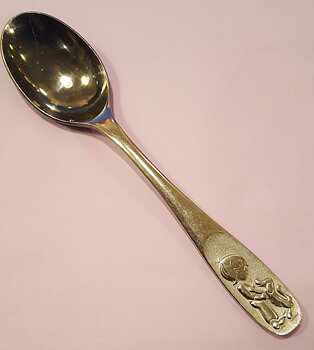 Child with dog spoon