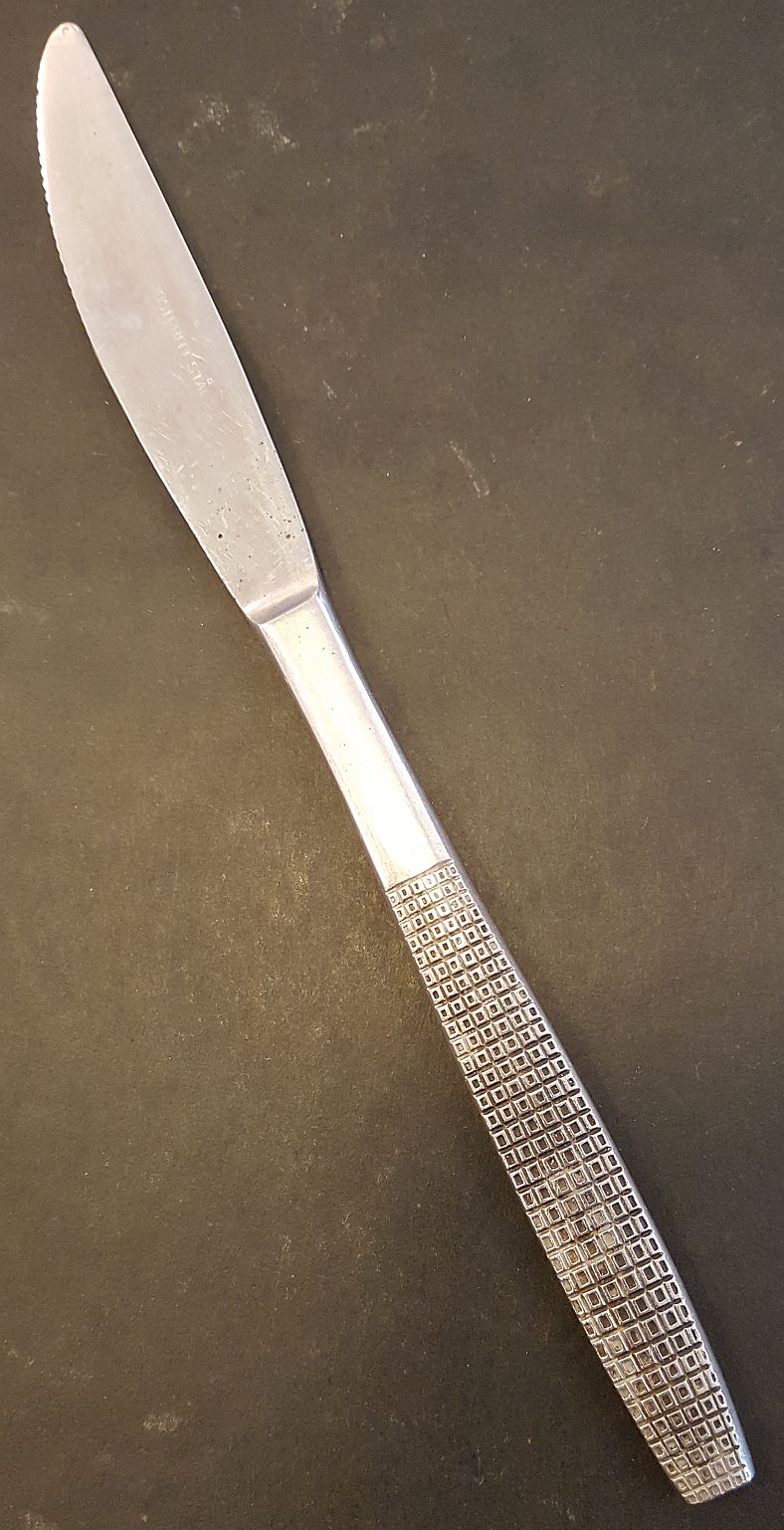 Rutigt skaft med prickar kniv