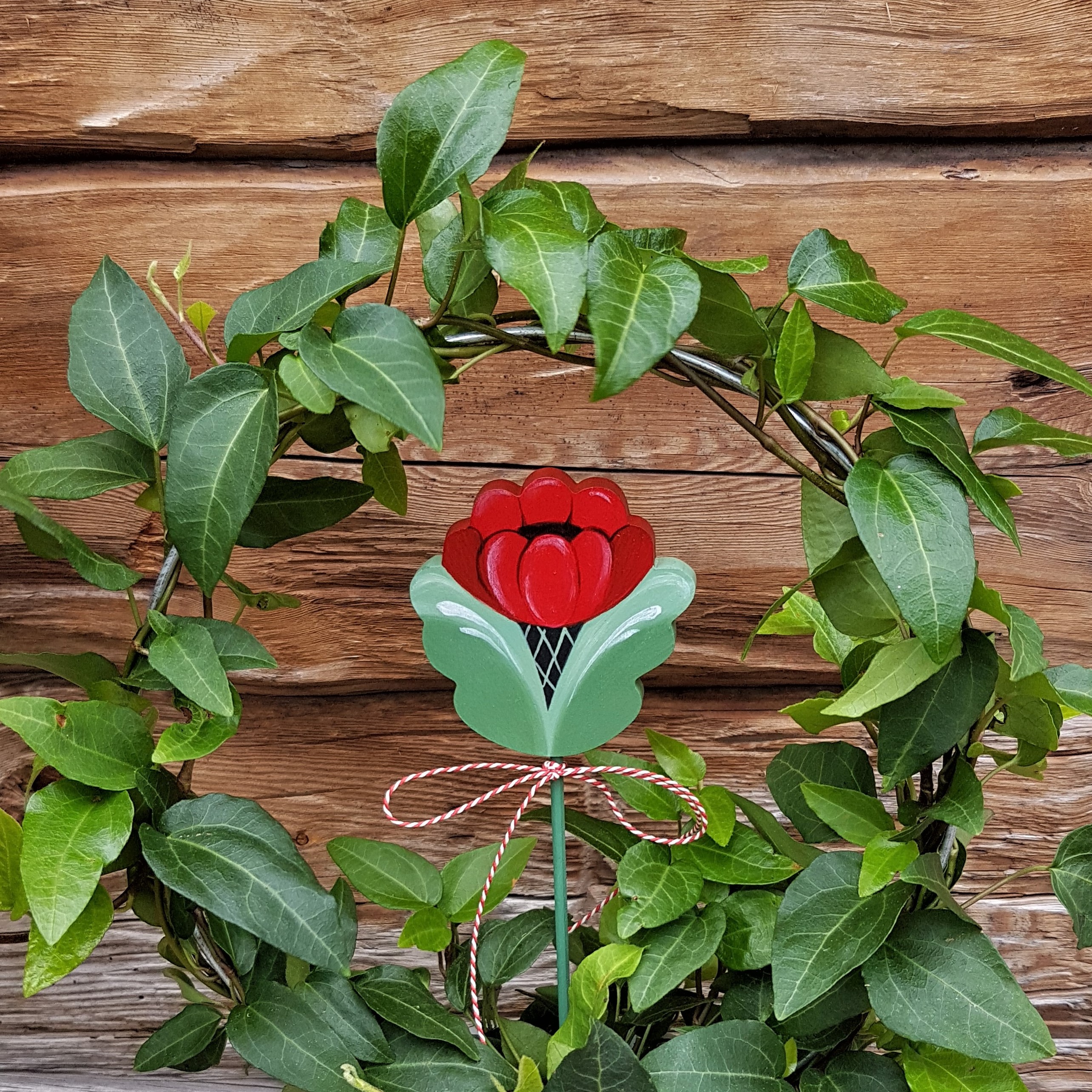 Blompinne "Vinterkurbits" röd
