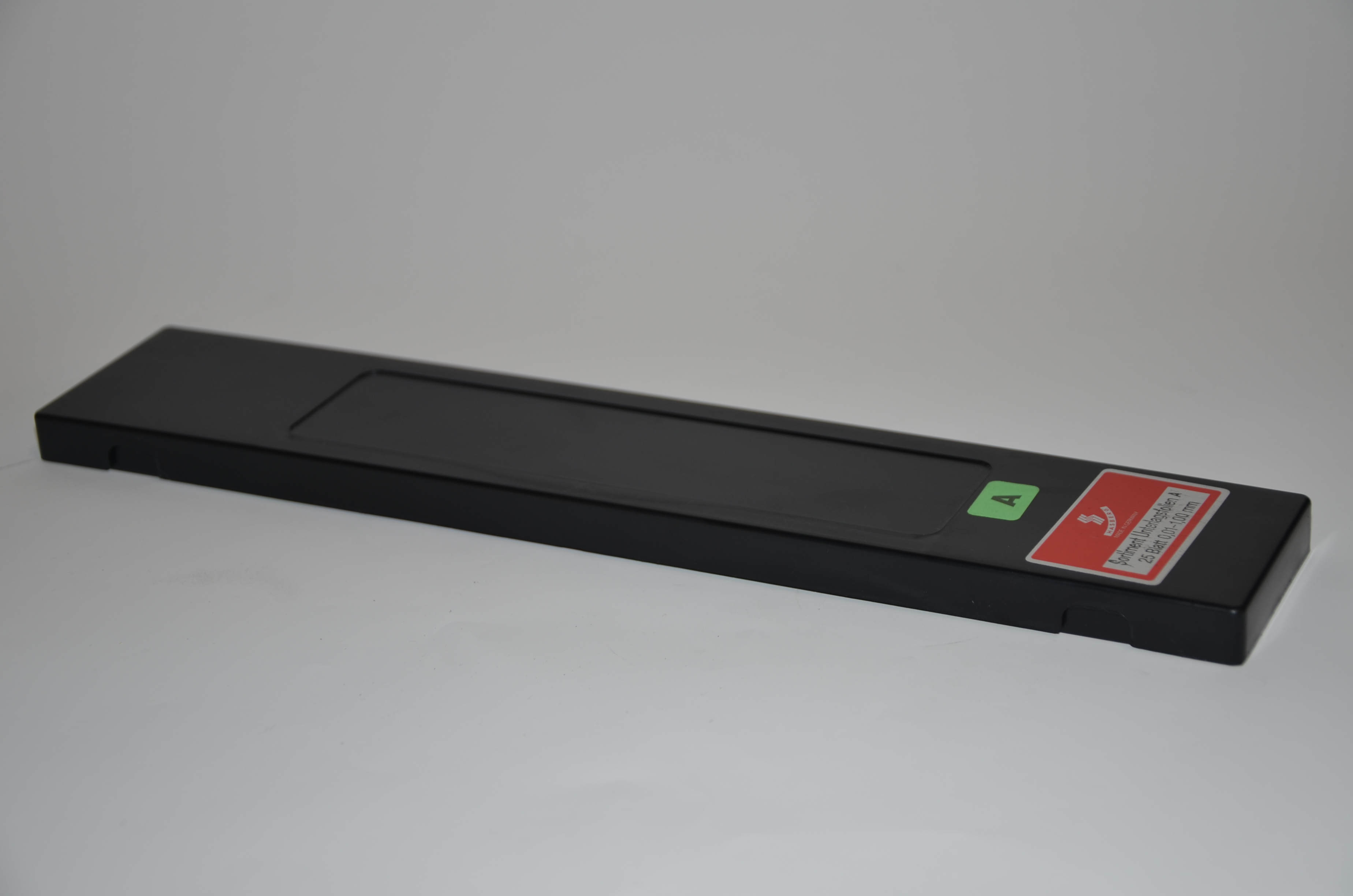 Underläggsfolie, sort A 50 x 300 mm, 0,01 - 1,00