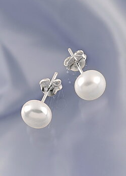 Pearls encased on silver pin