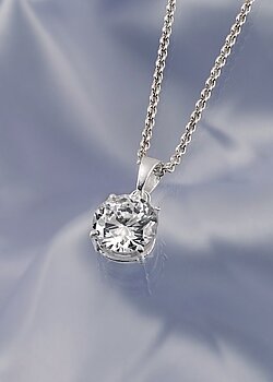 Cubic zirconia encased in silver on a silver chain