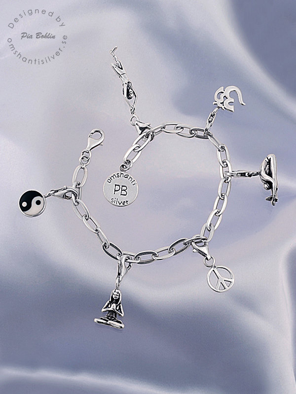 Silverbracelet with 7 yoga charms