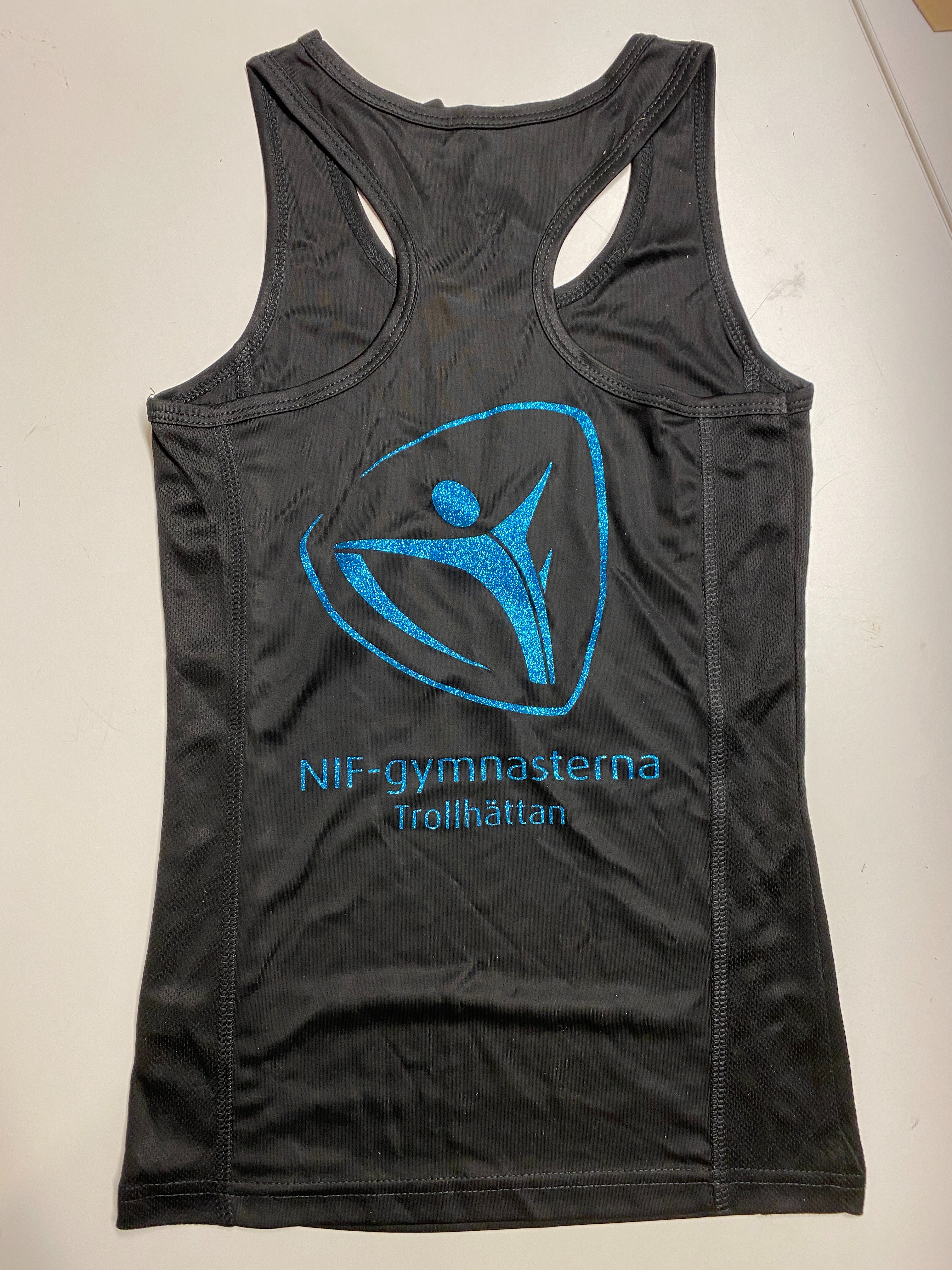Funktionslinne med brottarrygg, flick/dam, med NIF-gymnasternas glitterlogo