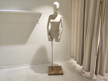 Fabric-covered mannequins with articulated arms