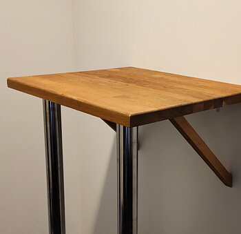 Wall-mounted standing table