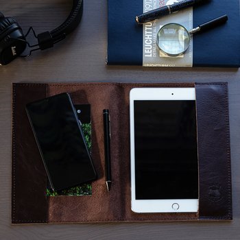 Brown book cover in leather with wild dragons