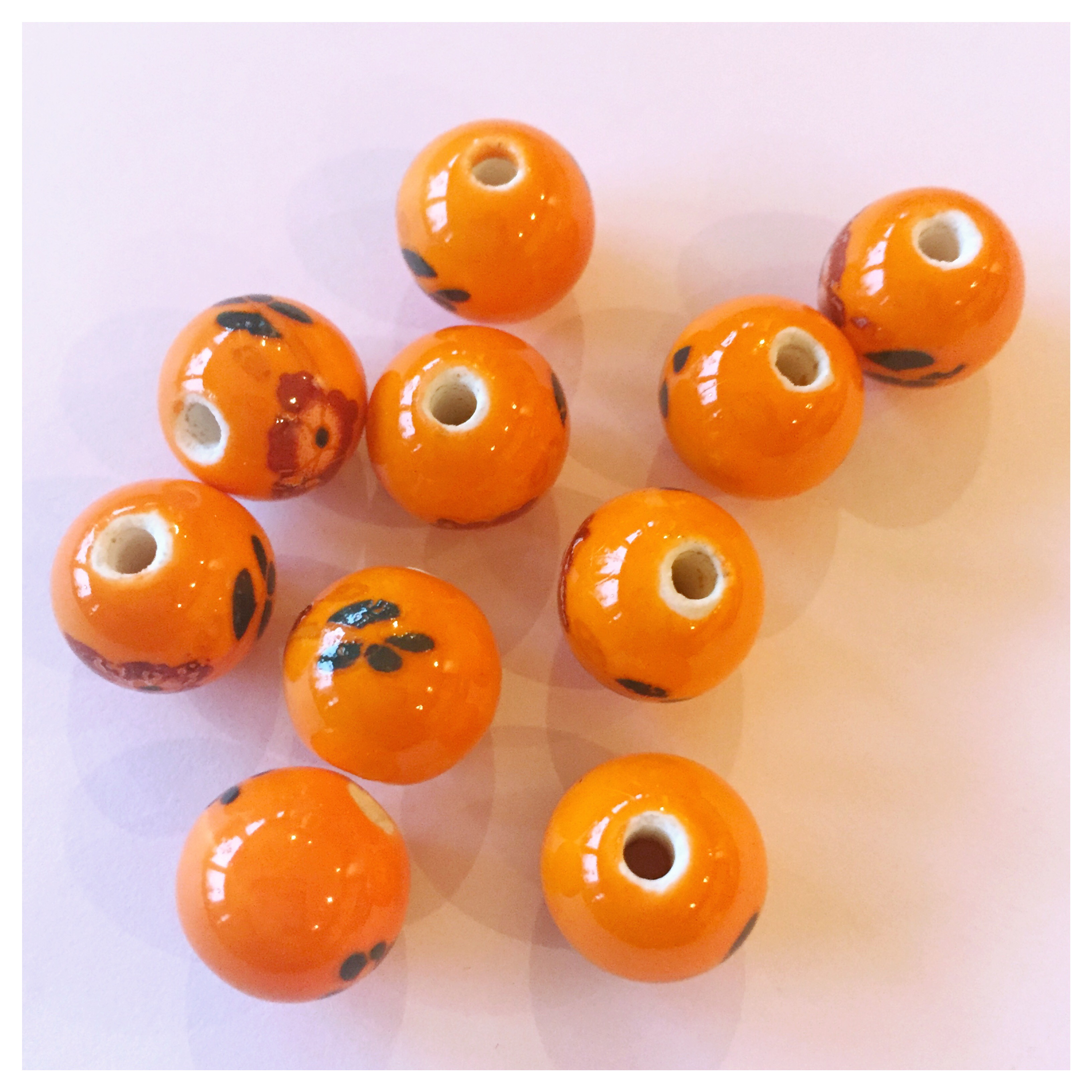 Blompärla-orange och svart 12mm, 10 st, porslinspärla