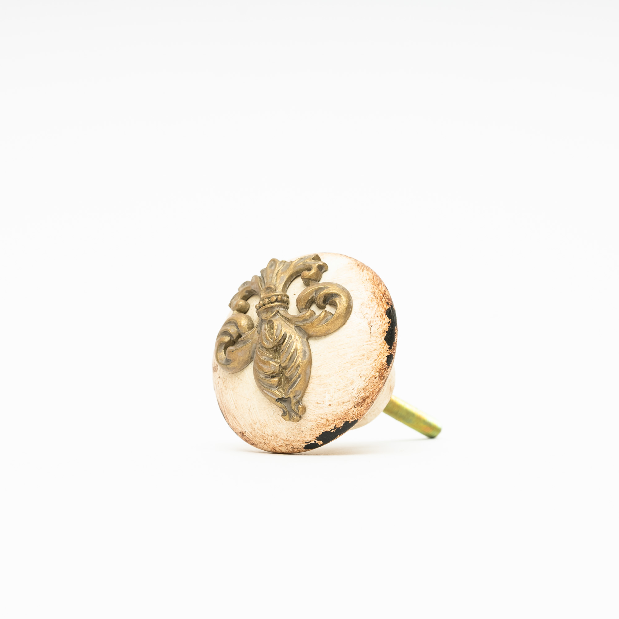 Dörrknopp i beige med fransk lilja i ornament mönster