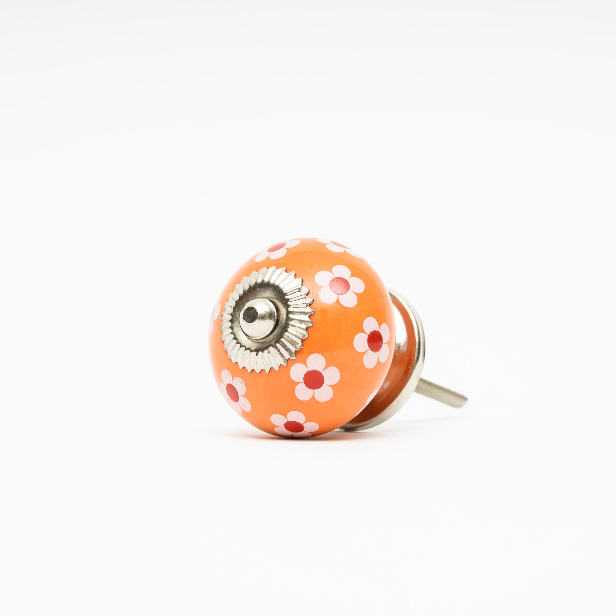 Rund knopp i orange med söta små blommor