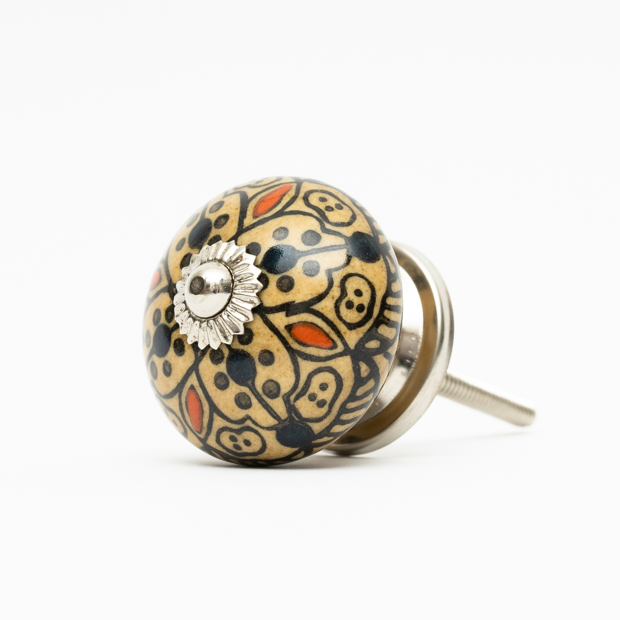 Schubladenknopf mit floralem Muster in Beige und Schwarz mit silbernem Detail