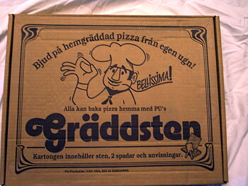 Grädda egen Pizza på sten av täljsten