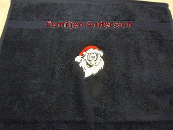 Handduk med tomte och valfri brodyrtext